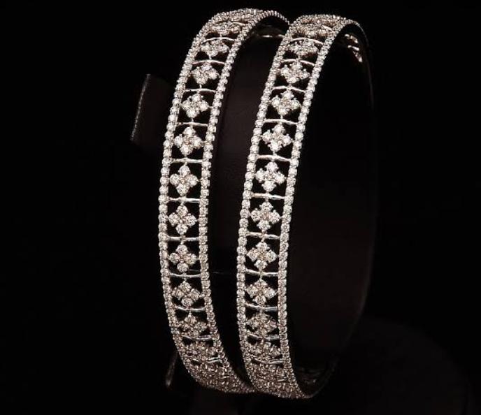 ORRA Diamond Jewellery  Style up and sizzle in your favorite lounge night  look by pairing a trendy diamond bracelet and with edgy diamond and gold  rings from the DESIRED collection by
